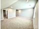 Spacious bedroom features plush carpet, a window and a walk-in closet at 9657 Liberty Hill Dr, Mint Hill, NC 28227