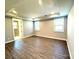 Spacious bedroom features wood floors, tray ceiling and lots of natural light at 9657 Liberty Hill Dr, Mint Hill, NC 28227