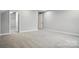 Spacious bedroom features neutral carpet, and trim, with natural light at 9657 Liberty Hill Dr, Mint Hill, NC 28227