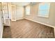 Bright bedroom featuring ample natural light and stylish wood flooring at 9657 Liberty Hill Dr, Mint Hill, NC 28227