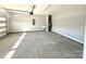 Clean garage space with sink and room for storage at 9657 Liberty Hill Dr, Mint Hill, NC 28227