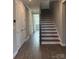 Elegant hallway with hardwood floors and double doors leading to bedrooms at 9657 Liberty Hill Dr, Mint Hill, NC 28227