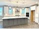 Bright kitchen featuring a large island, stainless steel appliances, pendant lighting and modern finishes at 9657 Liberty Hill Dr, Mint Hill, NC 28227
