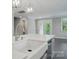 Stylish kitchen island with a white farmhouse sink, pendant lighting, and stainless steel faucet at 9657 Liberty Hill Dr, Mint Hill, NC 28227