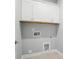 Functional laundry room with white cabinets and utility connections at 9657 Liberty Hill Dr, Mint Hill, NC 28227