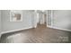Sunlit home office with double glass doors and gray walls at 9657 Liberty Hill Dr, Mint Hill, NC 28227