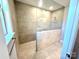 Contemporary walk-in shower with tiled walls and a bench at 9657 Liberty Hill Dr, Mint Hill, NC 28227