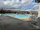 Large swimming pool with a seating area, perfect for relaxation and recreation at 9657 Liberty Hill Dr, Mint Hill, NC 28227