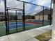 Well-maintained tennis court surrounded by a secure fence, offering a great recreational amenity at 9657 Liberty Hill Dr, Mint Hill, NC 28227