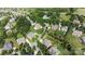 A scenic aerial view of a suburban neighborhood with mature trees and well-maintained lawns at 103 Glenholden Ln, Mooresville, NC 28115