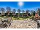 Backyard featuring a stone patio, fireplace, and manicured lawn at 103 Glenholden Ln, Mooresville, NC 28115