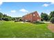 Large backyard with a patio, outdoor grill, and plenty of green space at 103 Glenholden Ln, Mooresville, NC 28115