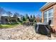 Backyard featuring a stone patio, fireplace, and manicured lawn at 103 Glenholden Ln, Mooresville, NC 28115