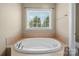 Close up view of a soaking tub in a bathroom at 103 Glenholden Ln, Mooresville, NC 28115