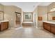 Large bathroom featuring a soaking tub, glass shower, and a double sink vanity at 103 Glenholden Ln, Mooresville, NC 28115