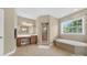 Well-lit bathroom featuring a soaking tub, glass-enclosed shower, and dual vanities at 103 Glenholden Ln, Mooresville, NC 28115