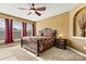 Cozy bedroom with a ceiling fan, ample natural light, and neutral carpet at 103 Glenholden Ln, Mooresville, NC 28115