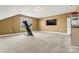 Large bonus room featuring carpet, tv, and treadmill at 103 Glenholden Ln, Mooresville, NC 28115