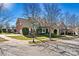 Traditional brick home with a well-manicured lawn and inviting front porch at 103 Glenholden Ln, Mooresville, NC 28115