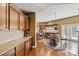 Kitchen area with granite countertops, stainless appliances, hardwood flooring, and an eat in dining space at 103 Glenholden Ln, Mooresville, NC 28115