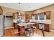 Spacious kitchen featuring granite counters, stainless appliances, island with seating and hardwood flooring at 103 Glenholden Ln, Mooresville, NC 28115