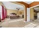 Spacious main bedroom suite featuring elegant furnishings, soft carpet and a ceiling fan at 103 Glenholden Ln, Mooresville, NC 28115