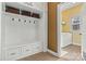 Mudroom includes built-in storage with bench, drawers, and shelving, adjacent to a laundry room at 103 Glenholden Ln, Mooresville, NC 28115