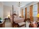 Spacious bedroom with four-poster bed and orange curtains at 104 Lazenby Dr, Fort Mill, SC 29715