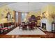 Elegant dining room features hardwood floors and a marble fireplace at 104 Lazenby Dr, Fort Mill, SC 29715