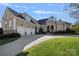 Stunning two-story home with a three-car garage and manicured lawn at 104 Lazenby Dr, Fort Mill, SC 29715