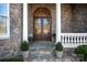 Elegant front entrance with stone facade and double doors at 104 Lazenby Dr, Fort Mill, SC 29715