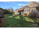 House exterior showcasing manicured lawn and stonework at 104 Lazenby Dr, Fort Mill, SC 29715