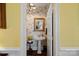 Charming powder room with toile wallpaper and pedestal sink at 104 Lazenby Dr, Fort Mill, SC 29715