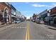 Scenic view of a charming town square with shops and parked cars at 104 Lazenby Dr, Fort Mill, SC 29715