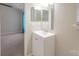 Bright bathroom with vanity and mirrored medicine cabinet at 10841 Twisted Bark Ln, Charlotte, NC 28213