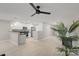 Open concept kitchen with white cabinets, black countertops and stainless steel appliances at 10841 Twisted Bark Ln, Charlotte, NC 28213