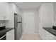 Updated kitchen featuring stainless steel refrigerator and white cabinets at 10841 Twisted Bark Ln, Charlotte, NC 28213