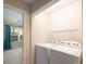 Stackable washer and dryer in a small laundry closet at 10841 Twisted Bark Ln, Charlotte, NC 28213