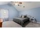 Main bedroom with king-size bed, ceiling fan, and grey carpet at 109 Copes Ct, York, SC 29732