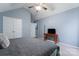 Main bedroom with king-size bed, ceiling fan, and TV stand at 109 Copes Ct, York, SC 29732