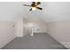 Bonus room with ceiling fan and access to upper level at 109 Washburn Range Dr, Mooresville, NC 28115