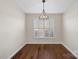 Formal dining room with hardwood floors and plantation shutters at 109 Washburn Range Dr, Mooresville, NC 28115