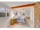 Cozy bedroom with wood floors, exposed beams, and a fireplace at 11270 Widenhouse Rd, Midland, NC 28107