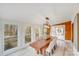 Dining room with large windows, wood accent wall and hardwood floors at 11270 Widenhouse Rd, Midland, NC 28107