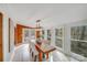 Spacious dining room with a long wooden table and large windows at 11270 Widenhouse Rd, Midland, NC 28107