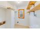 Laundry room with wood shelves and window at 11270 Widenhouse Rd, Midland, NC 28107