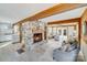 Open living room with stone fireplace and kitchen view at 11270 Widenhouse Rd, Midland, NC 28107