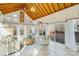 Sunroom with vaulted ceiling, wood beams, and deck access at 11270 Widenhouse Rd, Midland, NC 28107