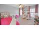 Charming bedroom with pink accents and built-in dresser at 114 Runningdeer Dr, Mooresville, NC 28117