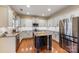 Modern kitchen with granite countertops and stainless steel appliances at 114 Runningdeer Dr, Mooresville, NC 28117